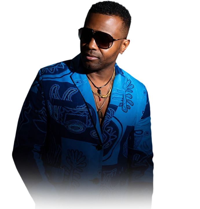 Mario of LEGAL MEN BAGAY in a blue patterned jacket and dark sunglasses